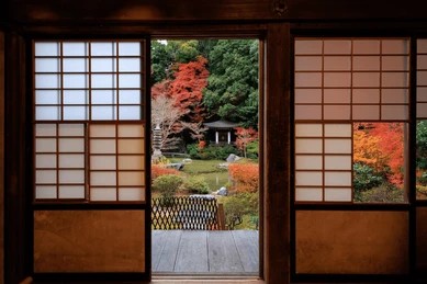 An autumn garden seen through open shoji doors