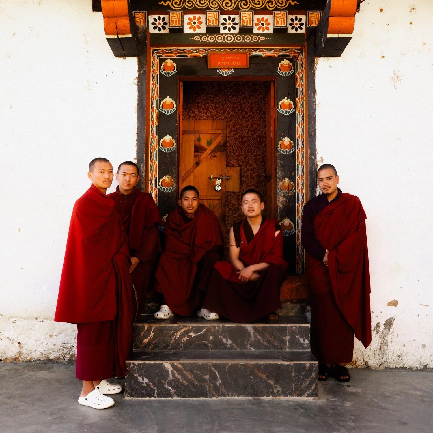 Monks gathered in the dining hall at Dodedhra Monastery