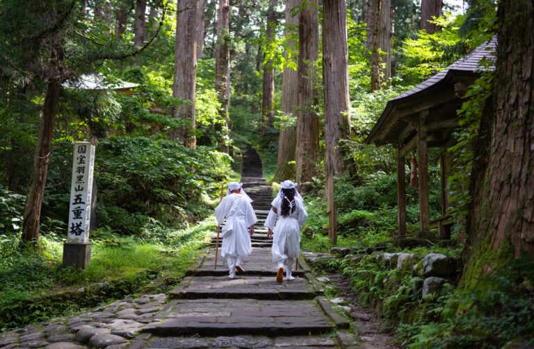 Two Yamabushi in white on the mountain