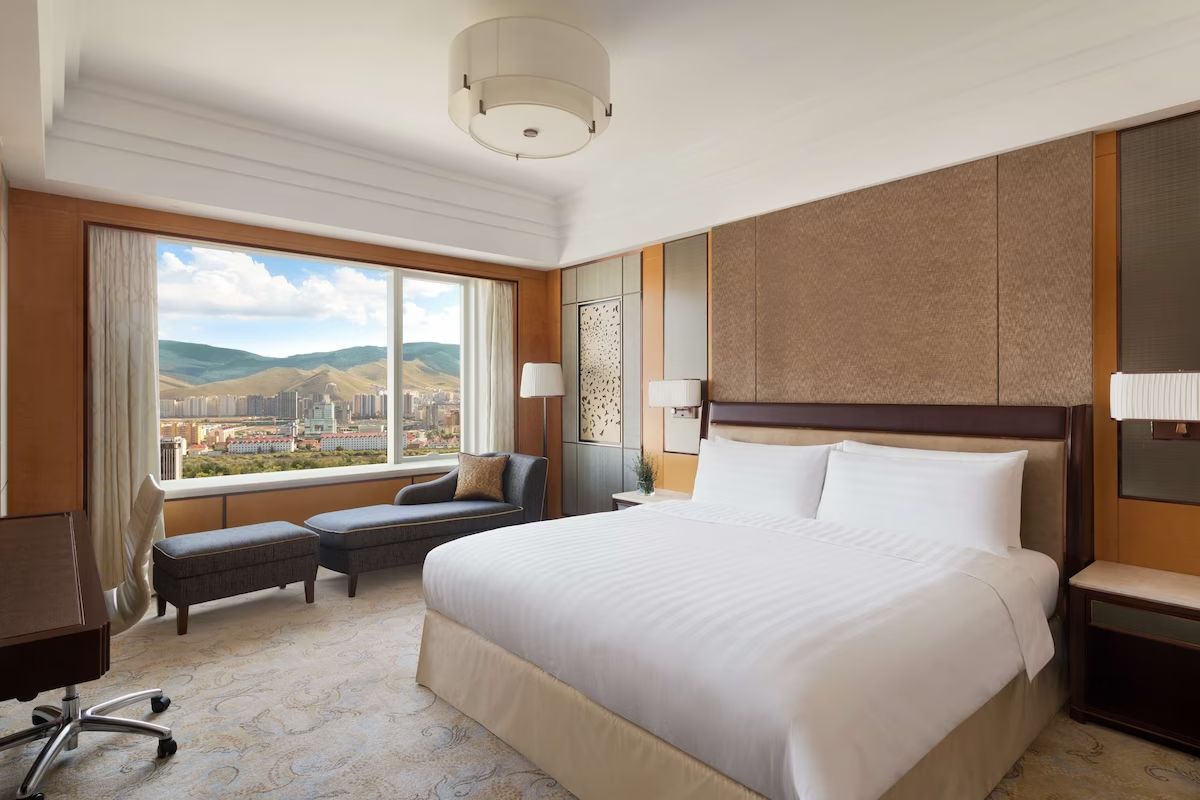 A premium hotel room overlooking Ulaanbaatar and the hills