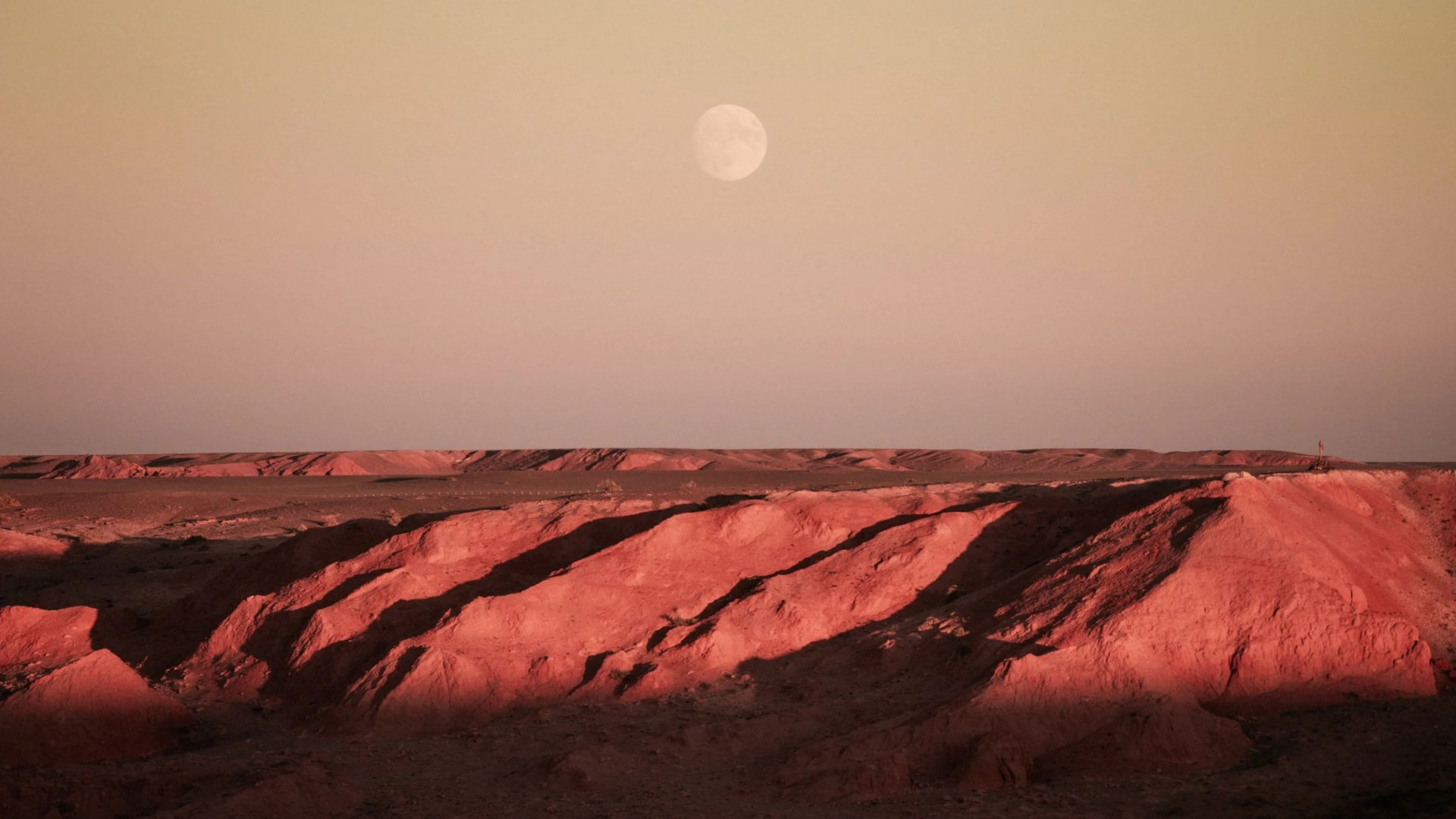 The moon rising over the Flaming Cliffs