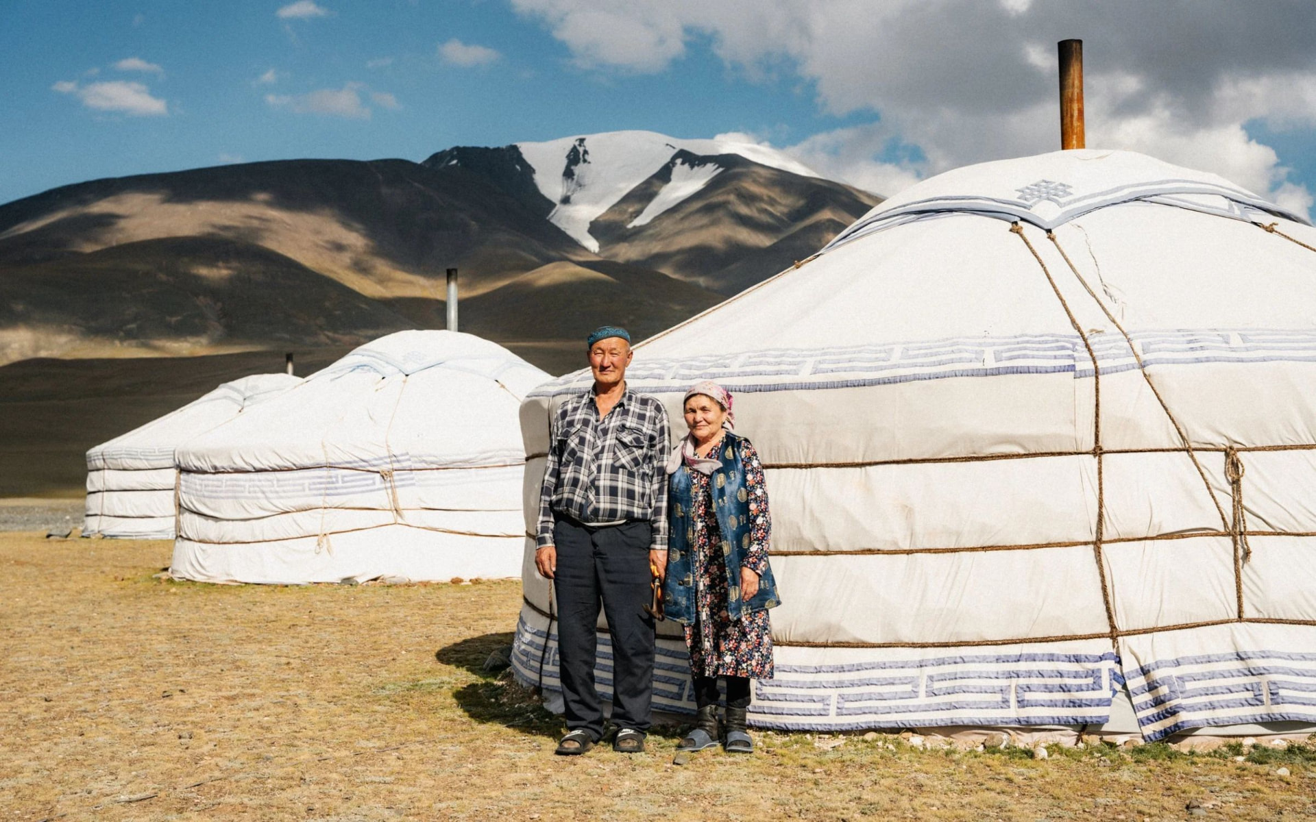 A Kazakh couple in front of their gers