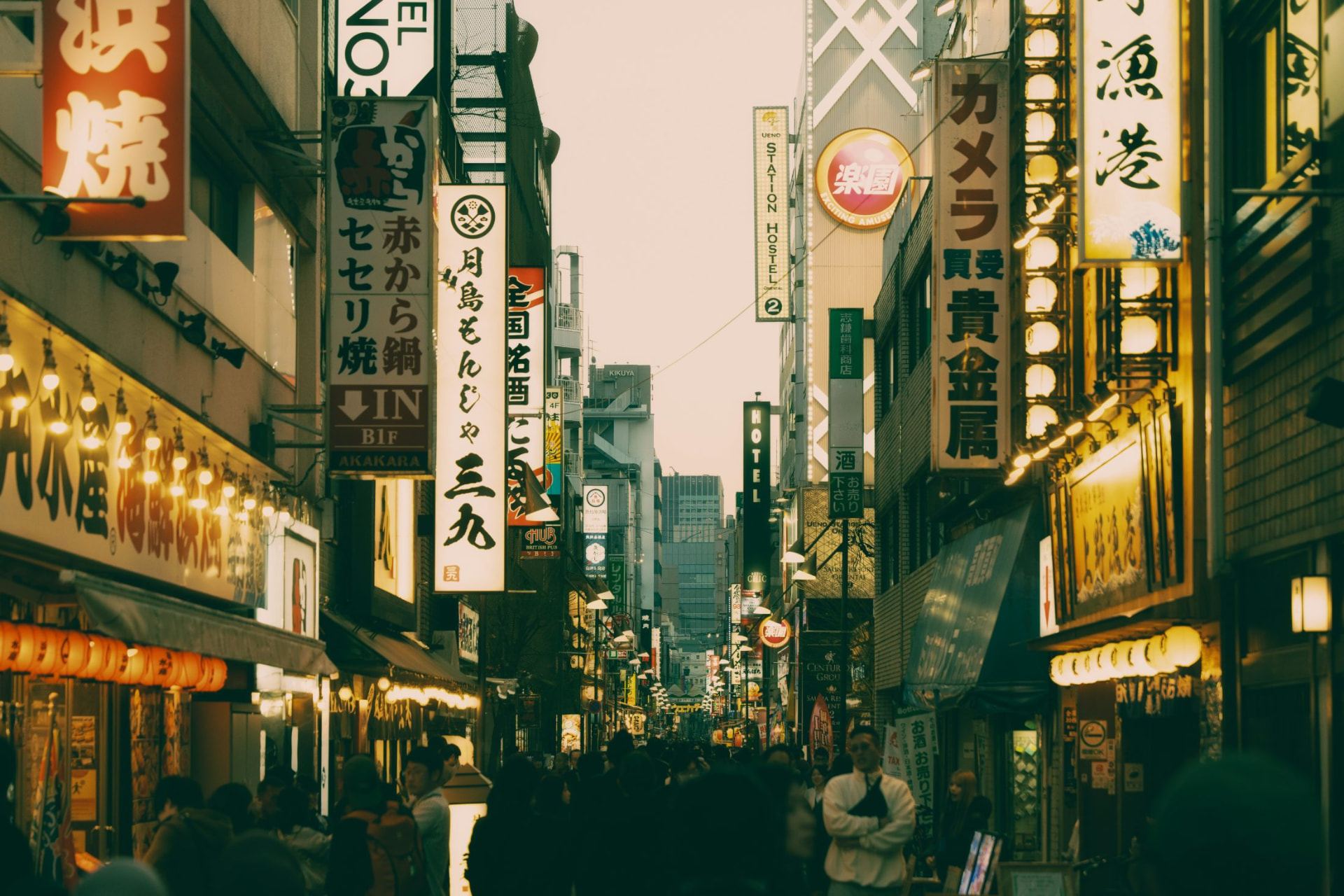 A busy Tokyo street lined with signs