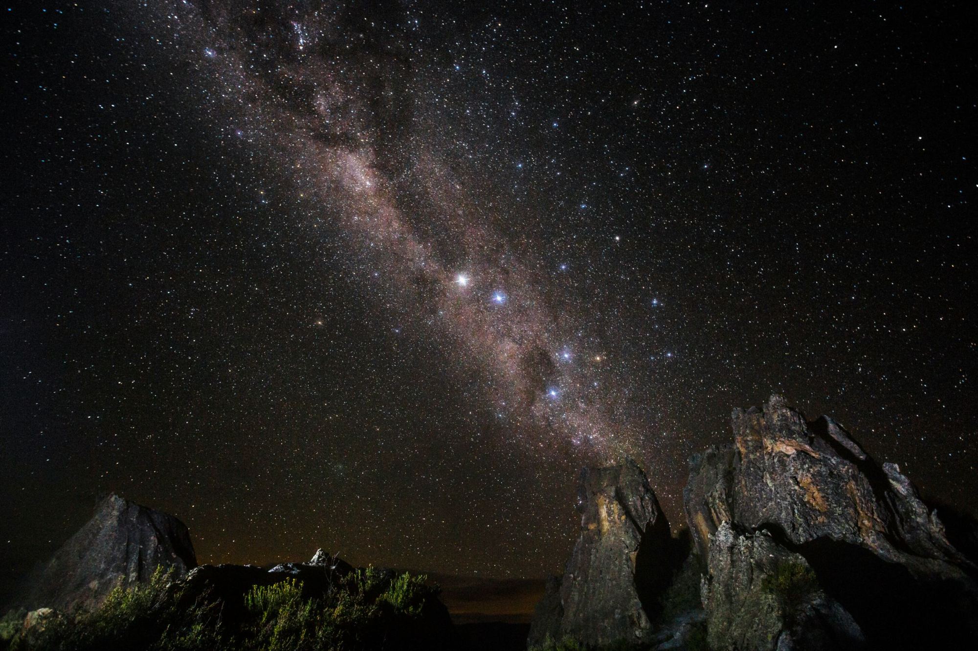 The Milky Way above rocky peaks