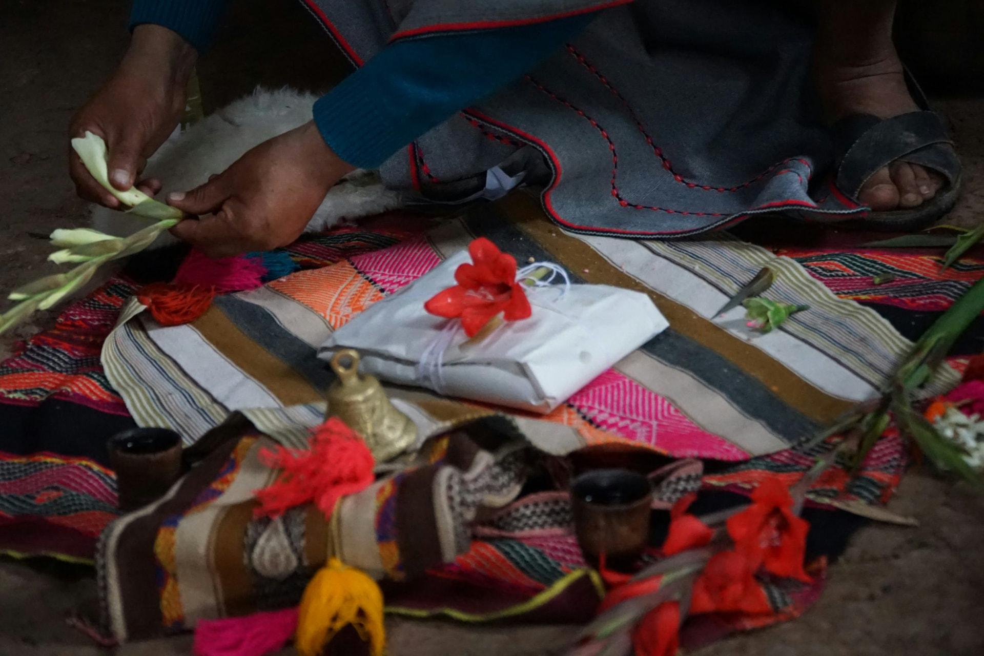 Hands preparing a despacho offering